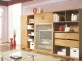 Holzschrank mit vielen Fächern und Schubladen, ideal für schrank neu gestalten ideen. Dekoriert mit Vasen und Büchern.