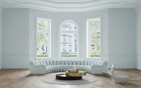 Ein helles Wohnzimmer mit geschwungener Couch, modernem Beistelltisch und einem futuristischen Sessel. Helle Wandfarben schaffen eine luftige Atmosphäre.